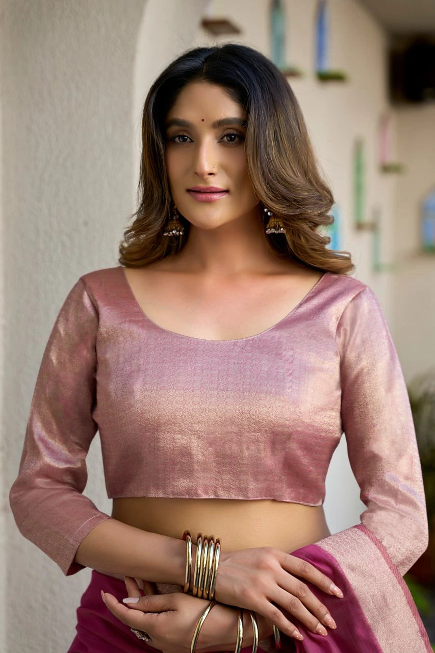 Woman wearing a pink blouse with a blurred background
